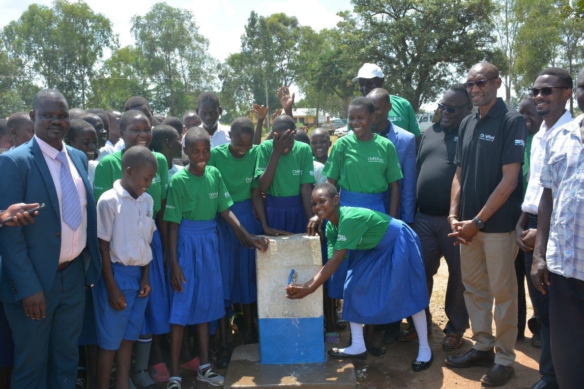 Borehole Children celebrate the unveiling of a new borehole built by ChildFund.
