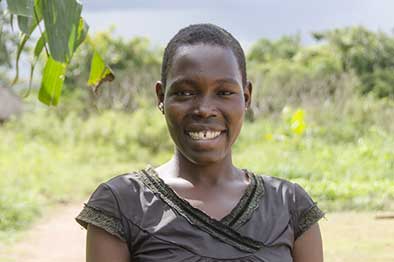 woman standing outdoors brown shirt portrait 